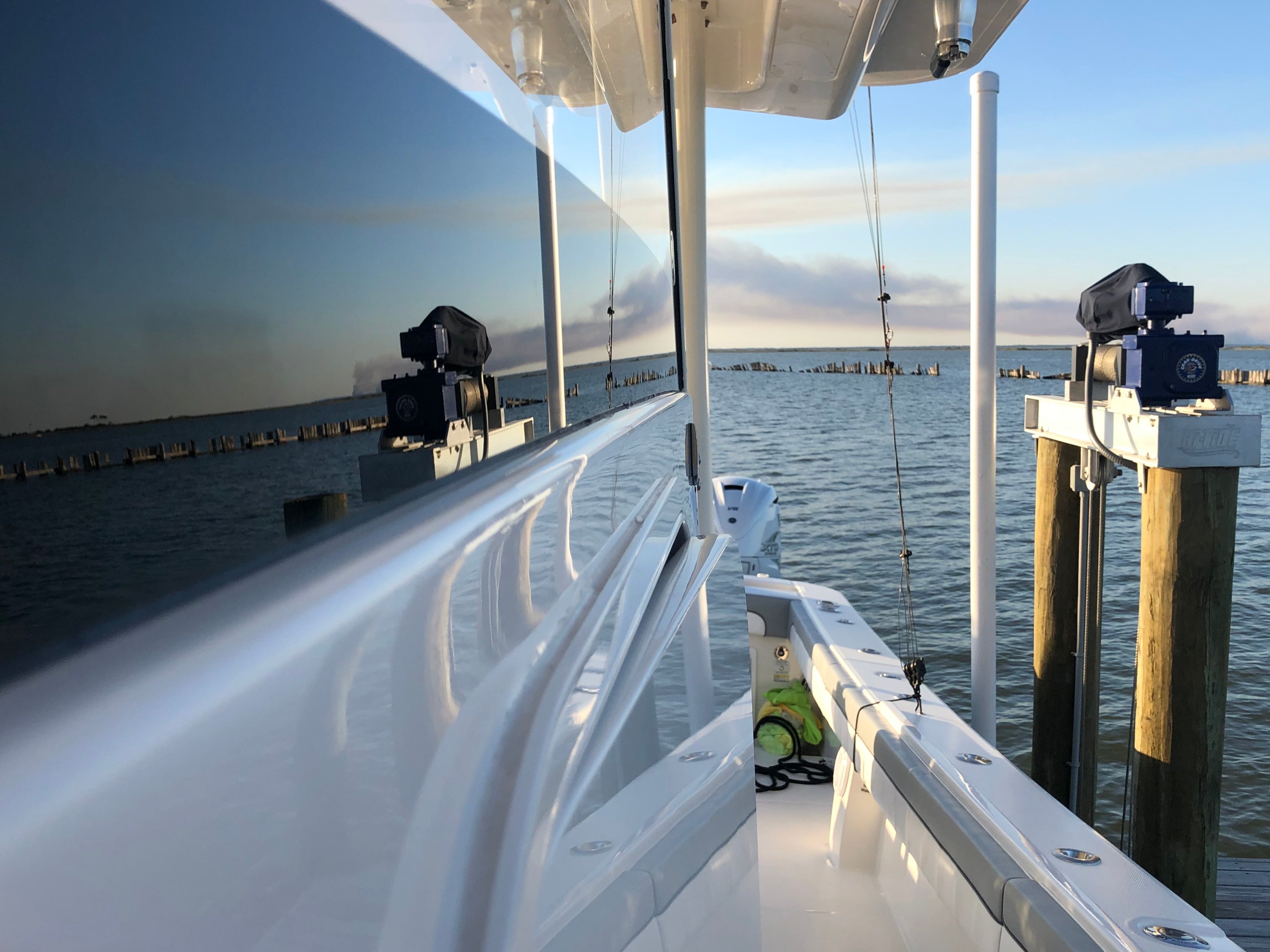 Image showing starboard side of yacht reflecting water off of glass and side of boat from ceramic work done.